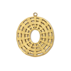 Detailed macro view of a gold hollow vintage steel pendant with an intricate woven texture
