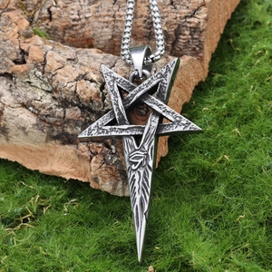 Vintage stainless steel pentagram necklace with eye of horus pendant on natural tree bark