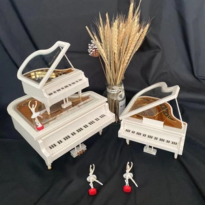 Ivory white piano music box with rotating ballet dancer figurines in large and small sizes