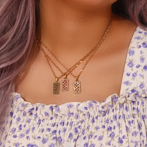 Gold plated stainless steel pendant necklace with green purple and white zircons