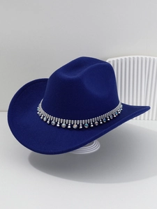 Detail of blue felt cowboy hat featuring shimmering rhinestones and bead trim decoration