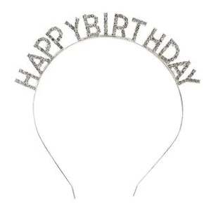 Detail of silver metal birthday headband with sparkling rhinestones spelling Happy Birthday