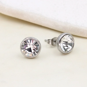 Macro shot of silver base stud earrings with clear sparkling cubic zirconia stones