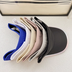 Top-down view showing various colors of breathable sports sun visors for outdoor running
