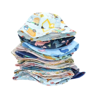 Stack of colorful toddler sun hats with various cartoon vehicle and animal patterns