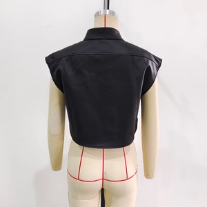 Back view of a cropped black faux leather vest featuring stylish lapels and stitching details