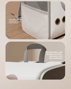 Detail view of pet carrier with side mesh pockets and reinforced comfort handles