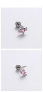 Detailed view of pink zircon heart and moon screw back stud earrings in silver finish
