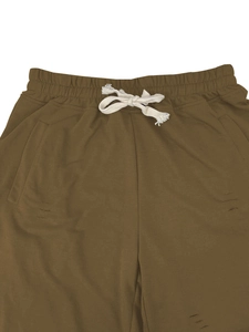 Detail of olive green casual shorts featuring elastic waist with beige woven drawstrings