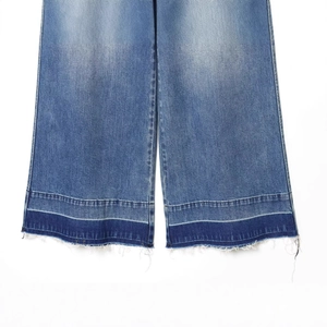 High-waisted wide-leg patchwork jeans in blue denim featuring frayed hem details