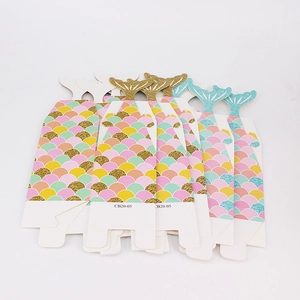 Mermaid party favor boxes with colorful fish scales and shimmering gold tail fin top