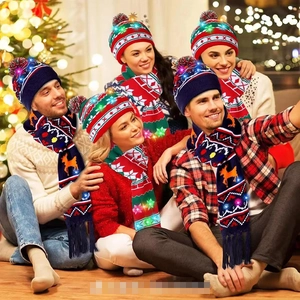 Close-up of knit Christmas hat and scarf set with LED lights and reindeer pattern