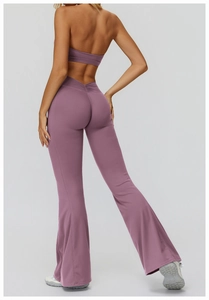 Macro detail of V-shaped high waist cross pleats on purple flared yoga pants
