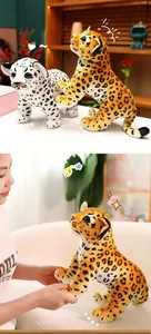 Detailed view of standing and lying leopard plush toys showing soft faux fur textures