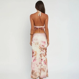 Detailed back view of a halter top and matching maxi skirt with pink floral print