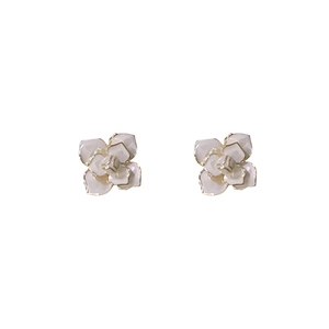 Elegant white camellia flower stud earrings with gold edges and petal texture