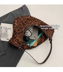 Interior detail of large leopard print tote bag showing spacious storage for essentials
