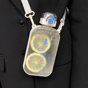 Minimalist square sports water bottle with blue lid and adjustable carry strap