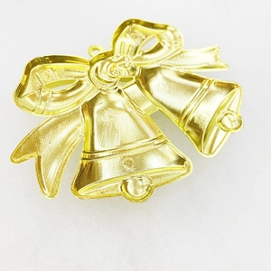 Golden Christmas bell hanging ornaments with red ribbon bow and metallic plating finish
