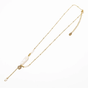 Detailed view of baroque pearl necklace with golden heart pendant on white background