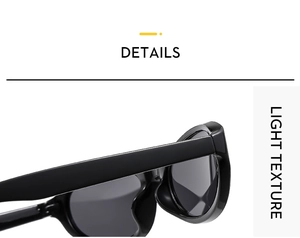 Close-up of sleek black oval cat-eye sunglasses showing polished glossy texture