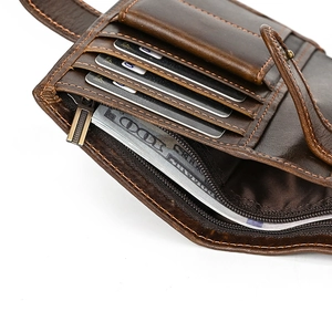 Detail of dark brown leather wallet showing stitching and multiple card slots structure