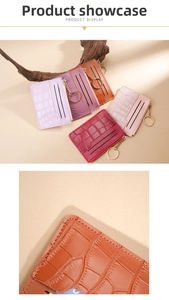 Detail of crocodile pattern card holder with gold zipper and keychain in various colors