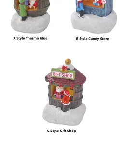 Detailed views of resin miniature Christmas shops with snow-covered bases and festive colors