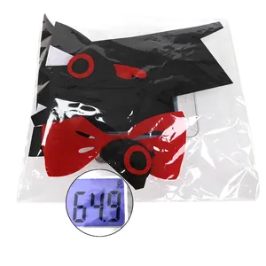 Halloween felt monster mask set with red bow tie on scale weighing 64.9g in package