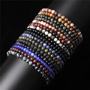 Close-up of 8mm natural stone beads bracelets featuring tiger eye and lava rock texture