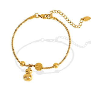 Gold stainless steel bracelet with gourd and Fu character charms on white background