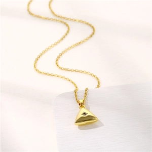 Geometric stainless steel necklace with gold triangle pendant and zircon star detail