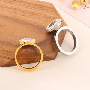 Detailed view of 18K gold plated stainless steel rings with clear and black crystal inlay