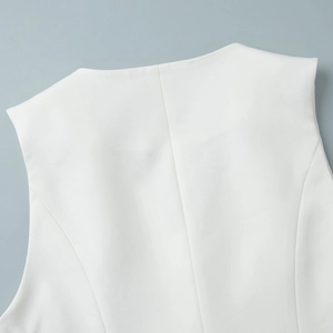 Detail shot of white sleeveless vest shoulder with fine twill texture and neat stitching