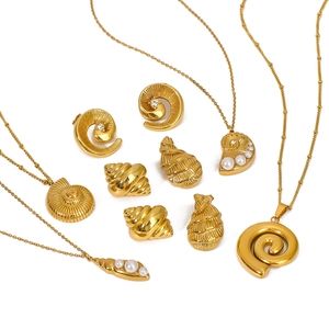 Golden sea shell jewelry set with pearls and zircons including necklace and earrings