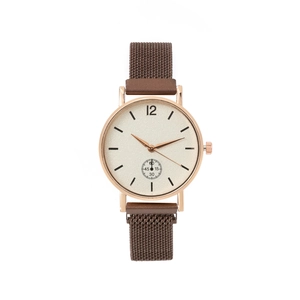 Detail of rose gold alloy quartz watch with minimalist dial and mesh strap