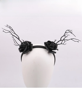 Close-up of black goth deer antlers headband with roses for Halloween party decor