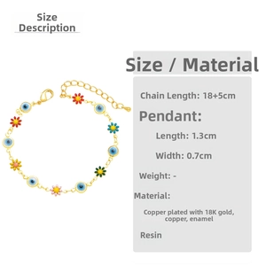 Detail showing 18K gold plated chain with colorful daisy and evil eye charms