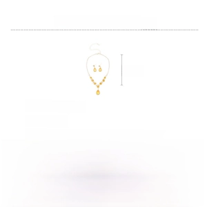 Detail view of copper and zircon jewelry set featuring yellow water drop pendants