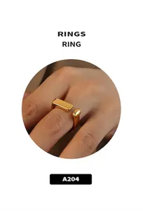 Minimalist gold-plated open geometric ring with rectangular and round accents on model