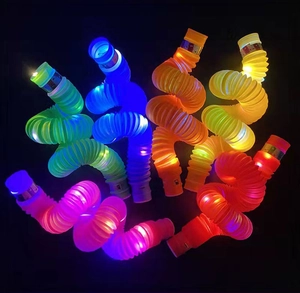 Vibrant glowing LED pop tubes in spiral arrangement over a dark black background