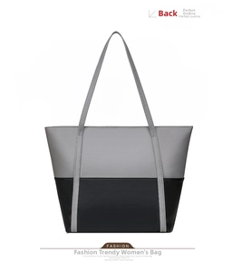 Rear view of large capacity faux leather tote bag in gray and black color block design