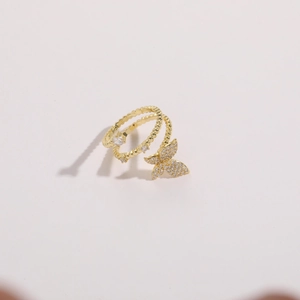 Detailed close-up of double-layered butterfly ring with sparkling zircon in gold finish