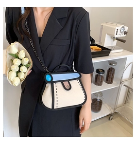 Stylized 2D cartoon shoulder bag in beige canvas with black chain strap on a model