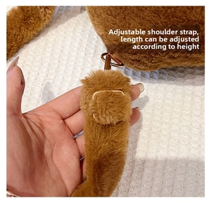 Detail of soft plush Capybara backpack featuring adjustable strap with gold metal buckle