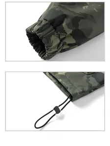Detail of elastic cuffs and adjustable drawstring hem on camouflage outdoor jacket