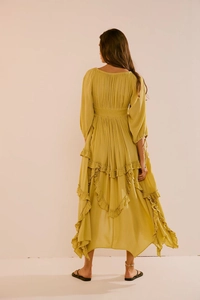 Back view of mustard yellow long dress with layered ruffles and elastic waist detail