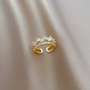 Macro detail of gold plated double layer crown ring with marquise and round cubic zirconia