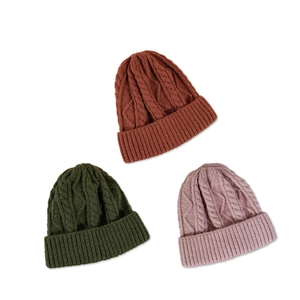 Diamond pattern cable knit beanies in rust, green and pink colors for outdoor wear