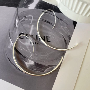 Minimalist 925 sterling silver hoop earrings with a sleek ripple design in bright silver